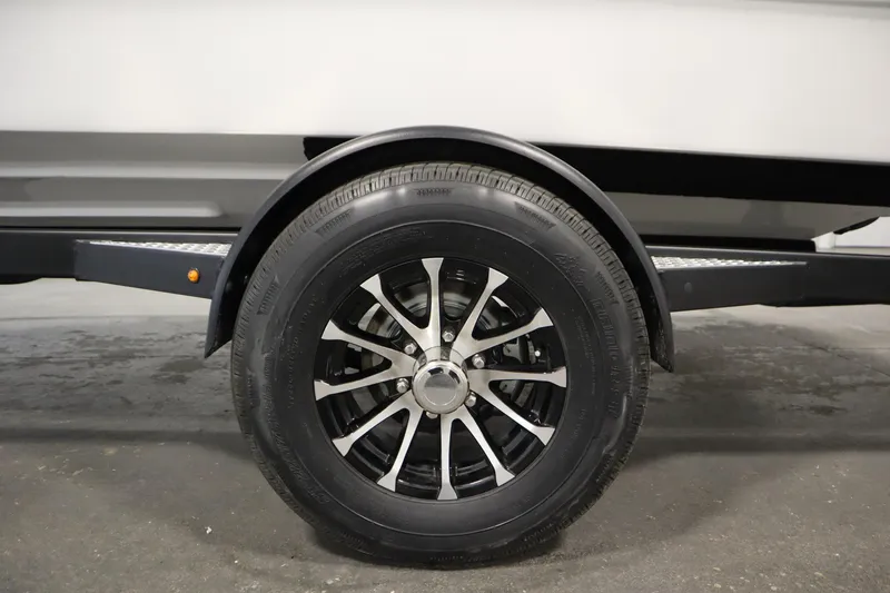 Slide: The Image of 2026 Four Winns H1 Freedom trailer wheel with sleek black and silver rim design. - 60