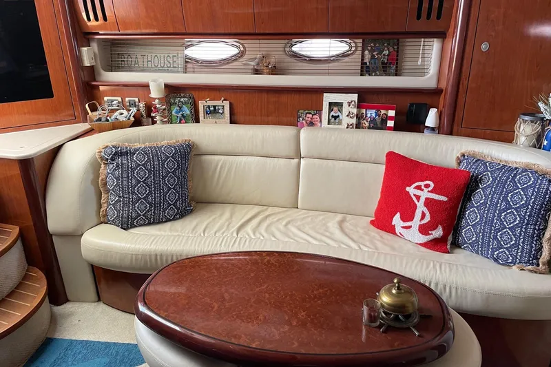 Slide: The Image of Luxurious 2004 Sea Ray 420 Sundancer interior with cozy seating and nautical decor. - 17