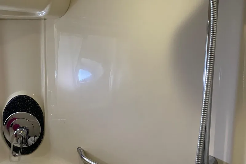 Slide: The Image of Shower area in 2004 Sea Ray 420 Sundancer yacht, featuring chrome fixtures. - 23