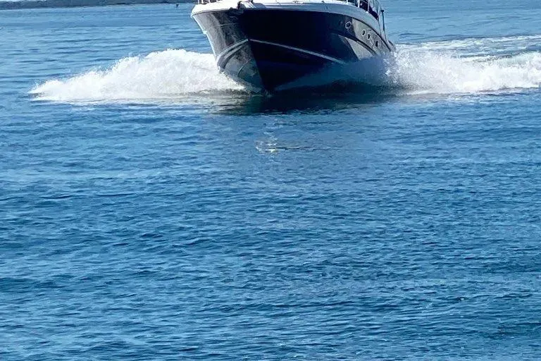 Slide: The Image of 2004 Sea Ray 420 Sundancer cruising on open water. - 9