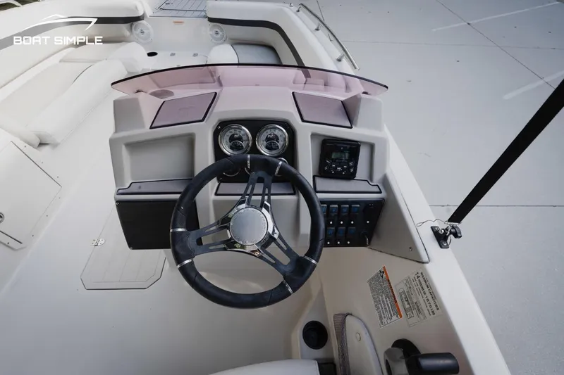 Slide: The Image of 2023 Starcraft SVX 211 OB boat dashboard with steering wheel and controls. - 11