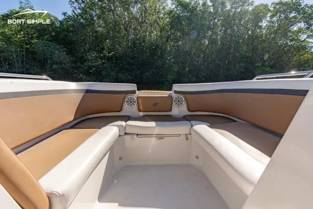 Slide: The Image of 2023 Starcraft SVX 231 OB DH boat interior with tan and white seating. - 6