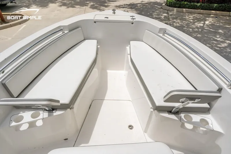 Slide: The Image of 2020 Release 210 RX boat interior with white seating and cup holders. - 8