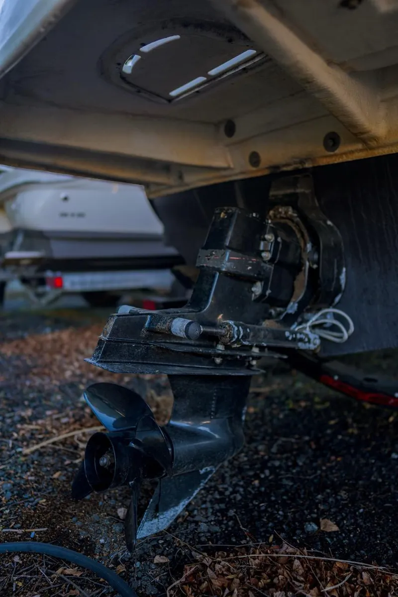 Slide: The Image of 2015 Sea Ray 220 Sundeck boat propeller and stern drive close-up. - 7