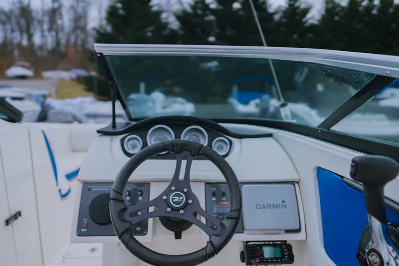 Slide: The Image of Steering wheel and dashboard of 2013 Sea Ray 220 Sundeck boat with Garmin system. - 8