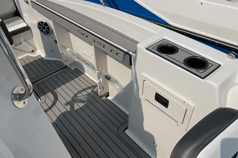 Slide: The Image of 2025 Starcraft SVX 191 OB CC boat interior with cup holders and storage compartments. - 10