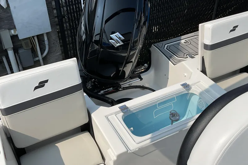 Slide: The Image of 2025 Starcraft SVX 191 OB CC boat interior with Suzuki engine and seating. - 16