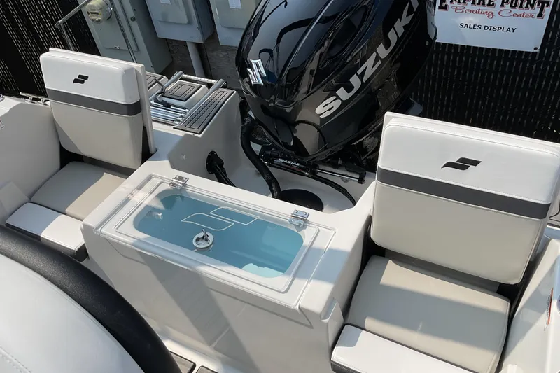 Slide: The Image of 2025 Starcraft SVX 191 OB CC boat interior with Suzuki engine, featuring seating and storage. - 17