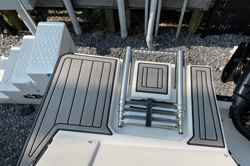 Slide: The Image of 2025 Starcraft SVX 191 OB CC boat with foldable ladder on deck. - 19