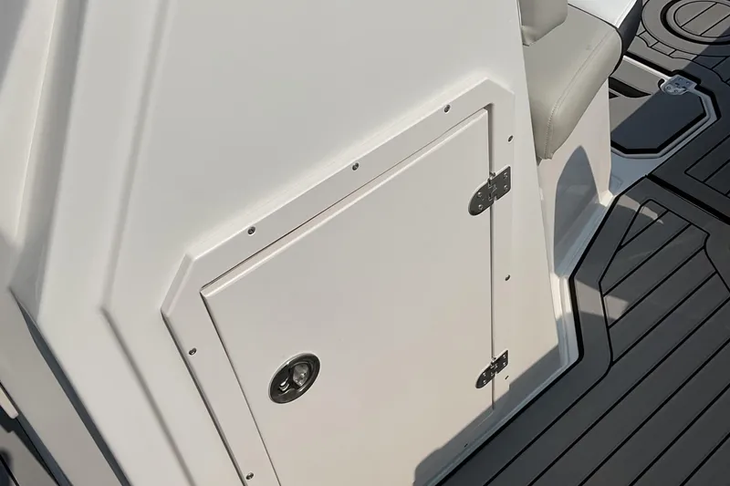 Slide: The Image of 2025 Starcraft SVX 191 OB CC boat interior with storage compartment and seating. - 21