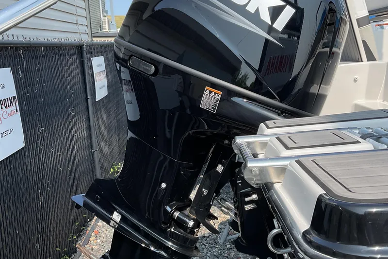 Slide: The Image of 2025 Starcraft SVX 191 OB CC boat with Suzuki outboard motor, displayed outdoors. - 23