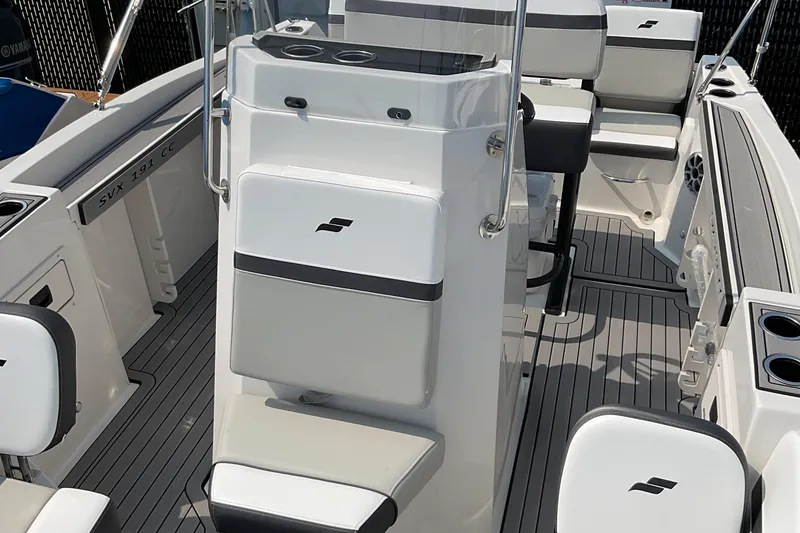 Slide: The Image of 2025 Starcraft SVX 191 OB CC boat interior with modern seating and sleek design. - 7