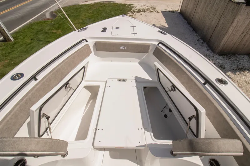 Slide: The Image of 2026 Sea Hunt Ultra 265 SE boat interior with open storage compartments. - 10