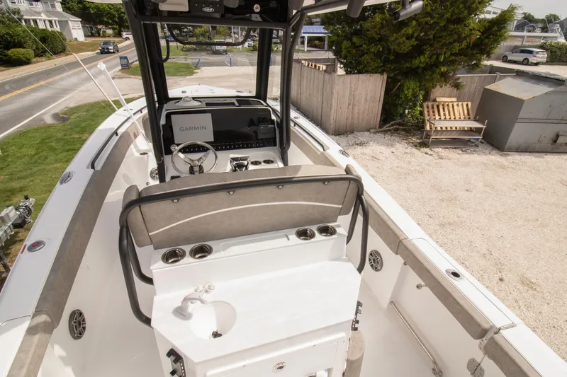 Slide: The Image of 2026 Sea Hunt Ultra 265 SE boat interior with Garmin navigation system. - 7