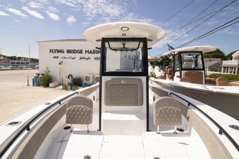 Slide: The Image of 2026 Sea Hunt Ultra 265 SE boat at Flying Bridge Marina under clear skies. - 8