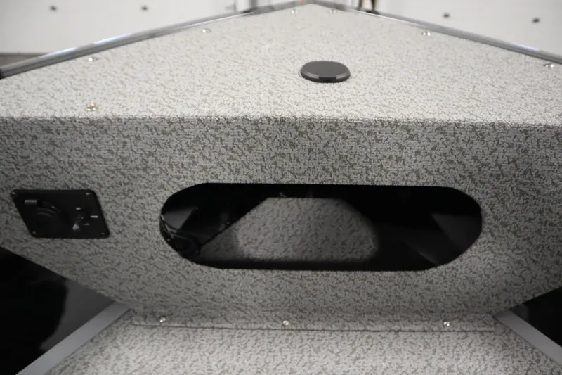 Slide: The Image of 2026 Crestliner 2050 Commander boat interior with textured surface and storage compartment. - 10