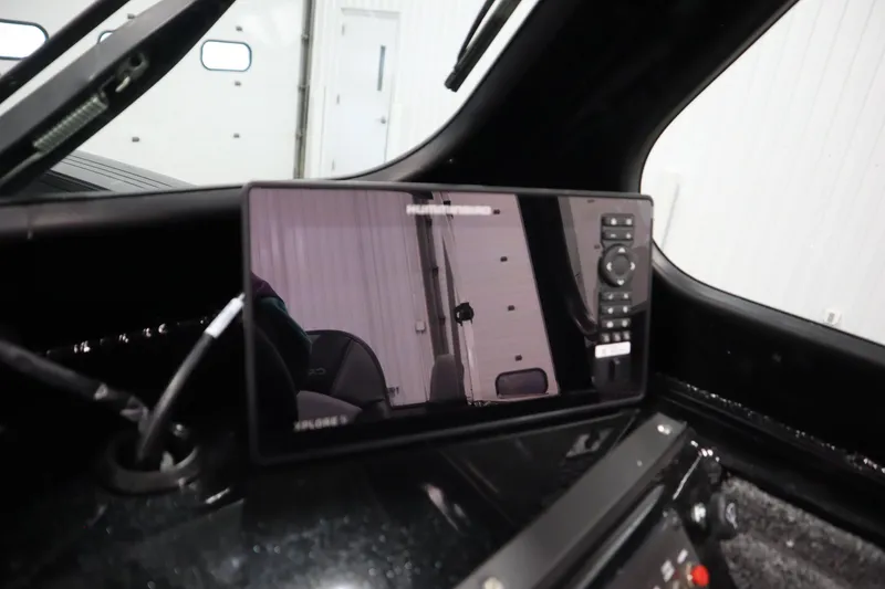 Slide: The Image of 2026 Crestliner 2050 Commander dashboard with advanced navigation display. - 19