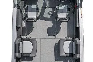 Slide: The Image of 2026 Crestliner 2050 Commander boat in a garage, black exterior, on a trailer. - 2