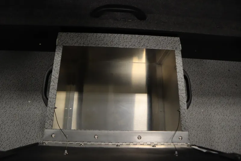 Slide: The Image of Storage compartment in 2026 Crestliner 2050 Commander boat, featuring durable metal interior. - 30