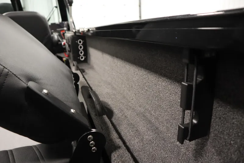 Slide: The Image of 2026 Crestliner 2050 Commander interior detail with seating and panel features. - 31