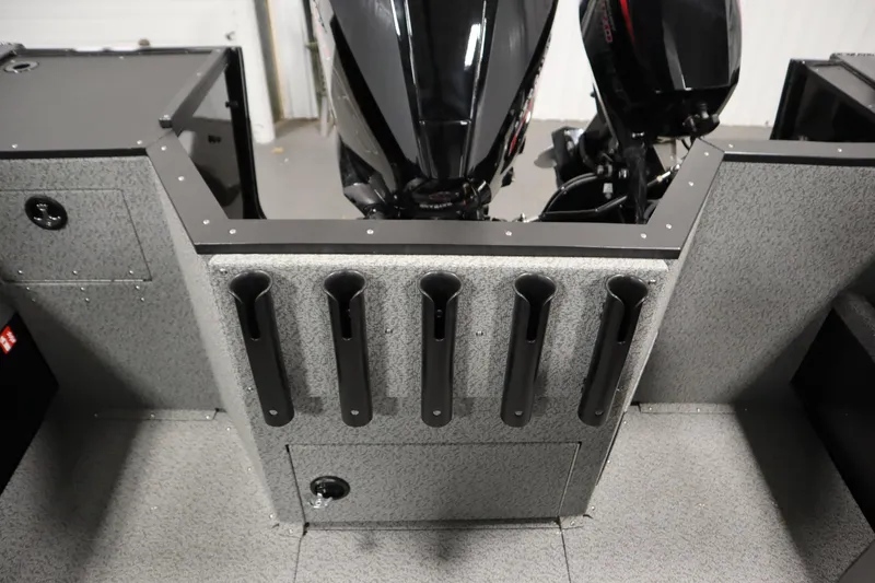 Slide: The Image of 2026 Crestliner 2050 Commander boat interior with rod holders and dual outboard motors. - 32