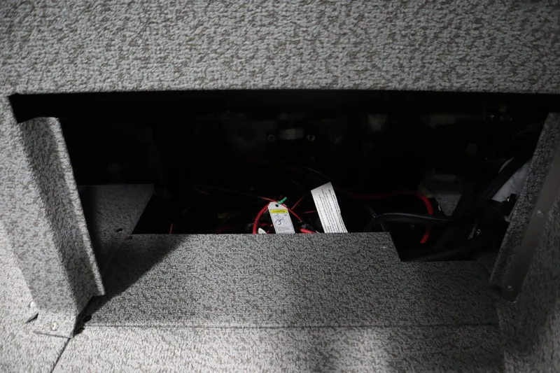 Slide: The Image of Interior compartment of 2026 Crestliner 2050 Commander boat, showing wiring and storage space. - 33