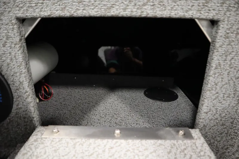 Slide: The Image of Interior view of 2026 Crestliner 2050 Commander boat storage compartment. - 35