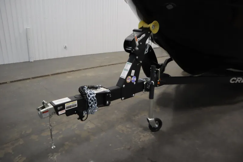 Slide: The Image of Trailer hitch of 2026 Crestliner 2050 Commander boat in a garage setting. - 38