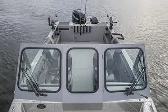 Slide: The Image of 2026 Crestliner 2050 Commander boat on trailer in indoor garage setting. - 4