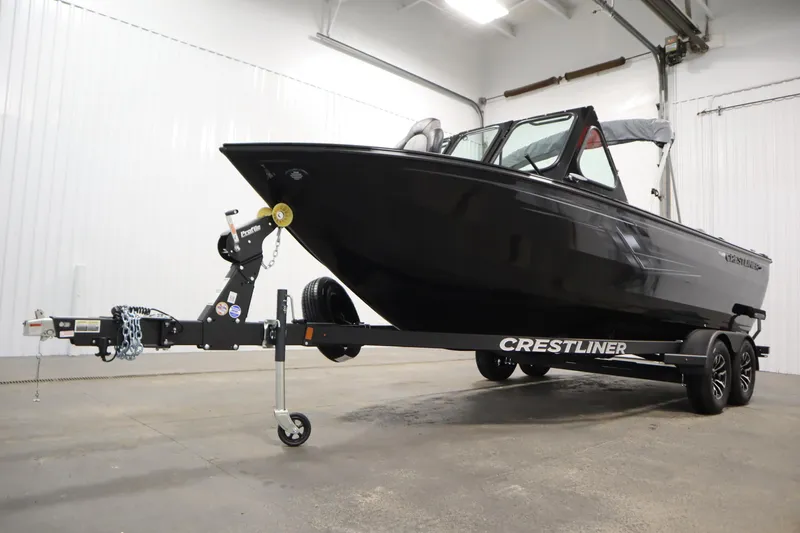 Slide: The Image of 2026 Crestliner 2050 Commander boat on trailer in indoor storage facility. - 40