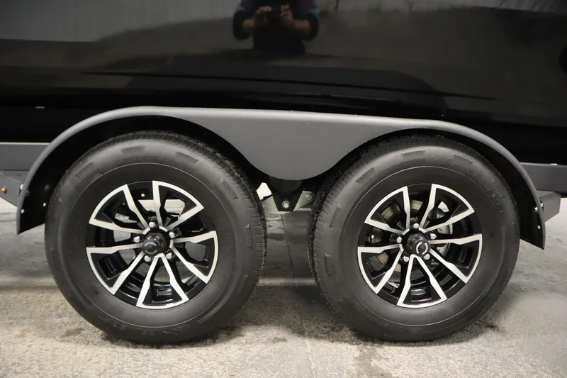 Slide: The Image of Trailer wheels of 2026 Crestliner 2050 Commander boat, featuring sleek black rims. - 41