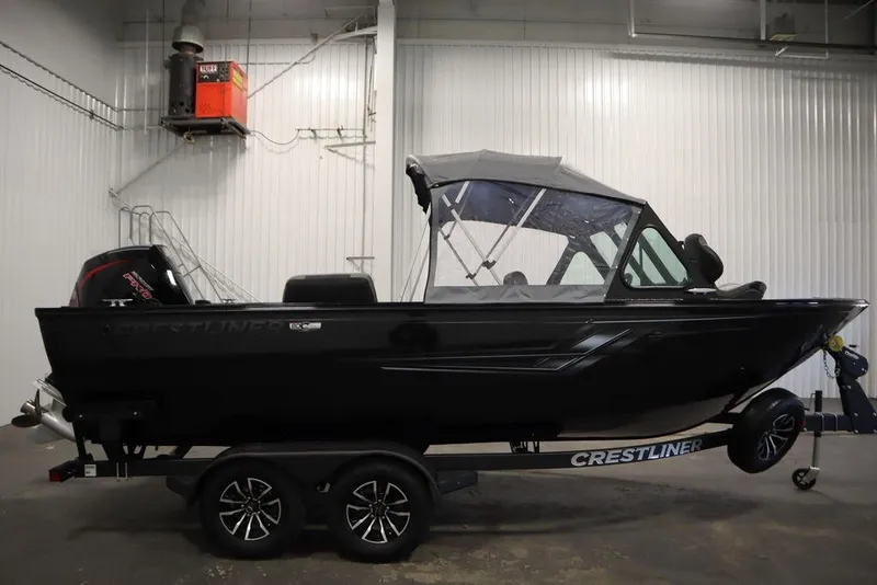 Slide: The Image of 2026 Crestliner 2050 Commander boat in indoor storage, side view. - 47