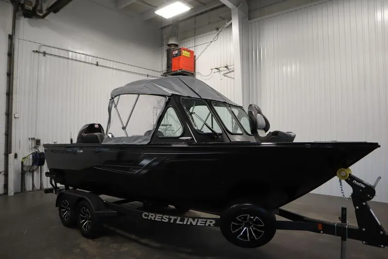 Slide: The Image of 2026 Crestliner 2050 Commander boat on trailer in indoor storage. - 51