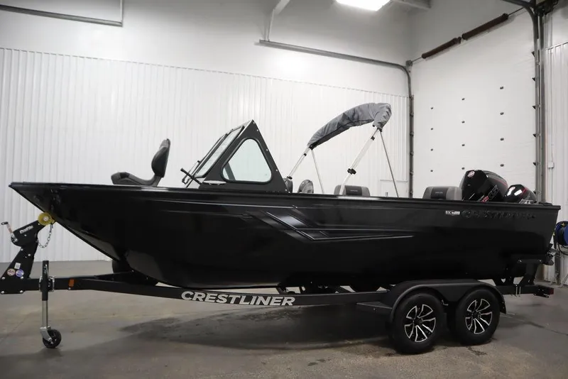Slide: The Image of 2026 Crestliner 2050 Commander boat on trailer in indoor showroom. - 54