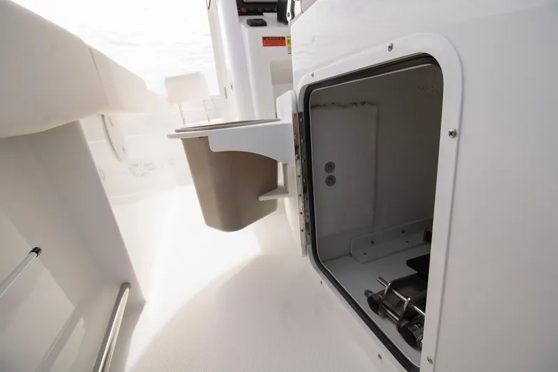 Slide: The Image of 2026 Sea Hunt Ultra 245 SE boat interior storage compartment. - 10