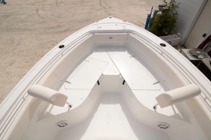 Slide: The Image of 2026 Sea Hunt Ultra 245 SE boat interior, featuring spacious seating and storage. - 13