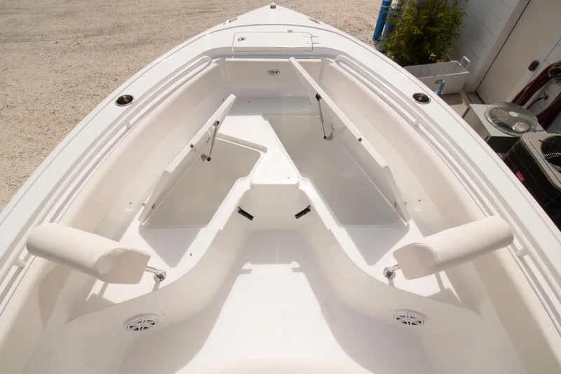Slide: The Image of 2026 Sea Hunt Ultra 245 SE boat interior with open storage compartments. - 14