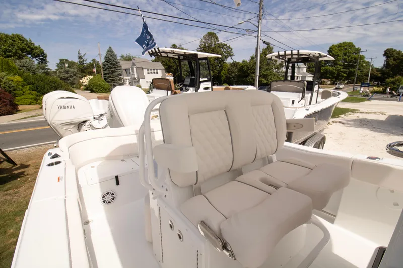 Slide: The Image of 2026 Sea Hunt Ultra 245 SE boat with Yamaha engines, featuring plush seating and modern design. - 3