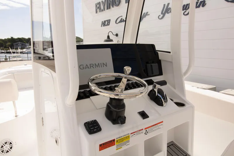 Slide: The Image of Steering console of 2026 Sea Hunt Ultra 245 SE boat with Garmin navigation system. - 5