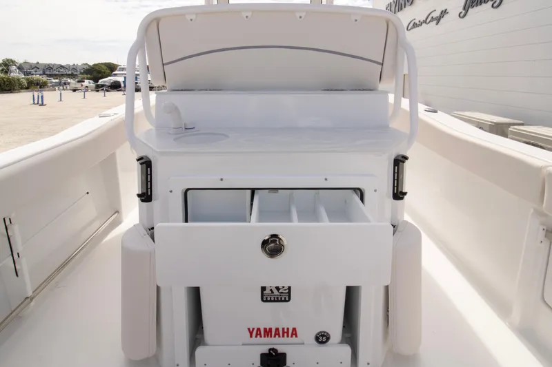 Slide: The Image of 2026 Sea Hunt Ultra 245 SE boat interior with Yamaha engine compartment. - 9
