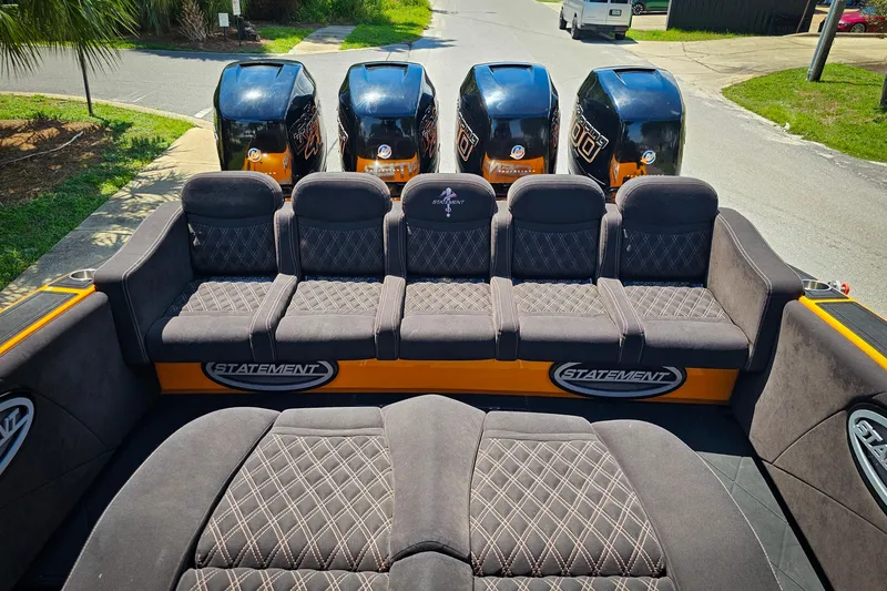 Slide: The Image of Luxurious seating on 2016 Statement 380 Open boat with powerful engines in the background. - 11