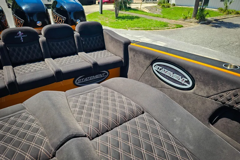 Slide: The Image of Luxurious seating on a 2016 Statement 380 Open boat with stylish diamond stitching. - 13