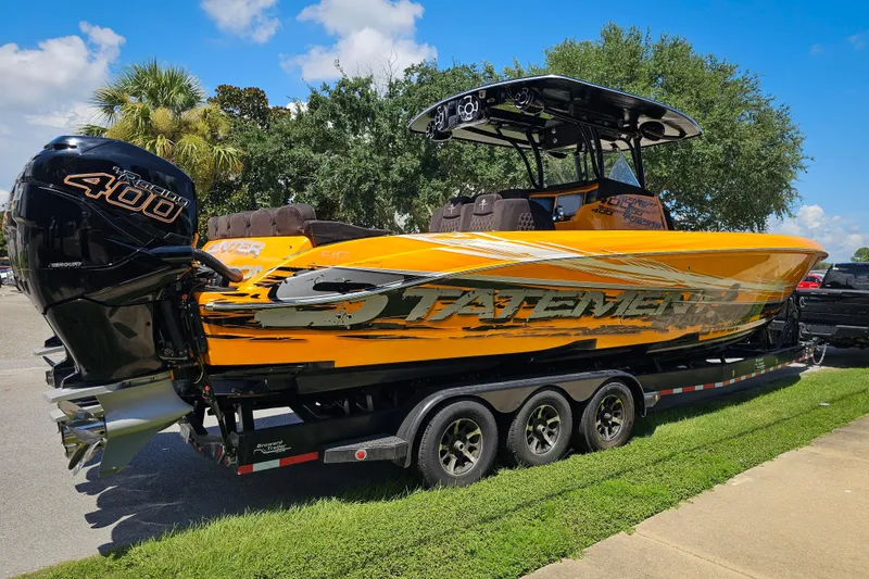 Slide: The Image of Orange 2016 Statement 380 Open boat on trailer, featuring powerful Mercury 400R engine. - 6