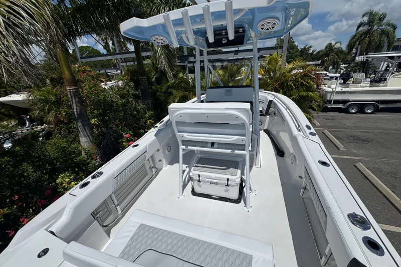 Slide: The Image of 2026 Blackfin 222 CC boat with sleek white deck and modern seating. - 13