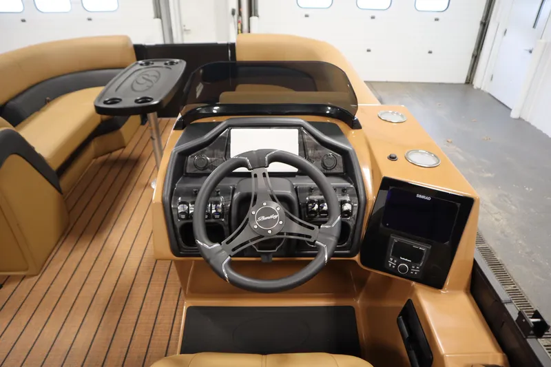 Slide: The Image of 2026 Bentley Pontoons Elite 223 Admiral Tri-toon dashboard with steering wheel and controls. - 20