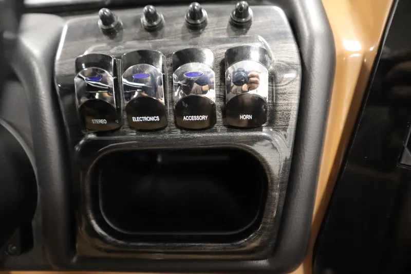 Slide: The Image of Control panel of 2026 Bentley Pontoons Elite 223 Admiral Tri-toon with labeled switches. - 24