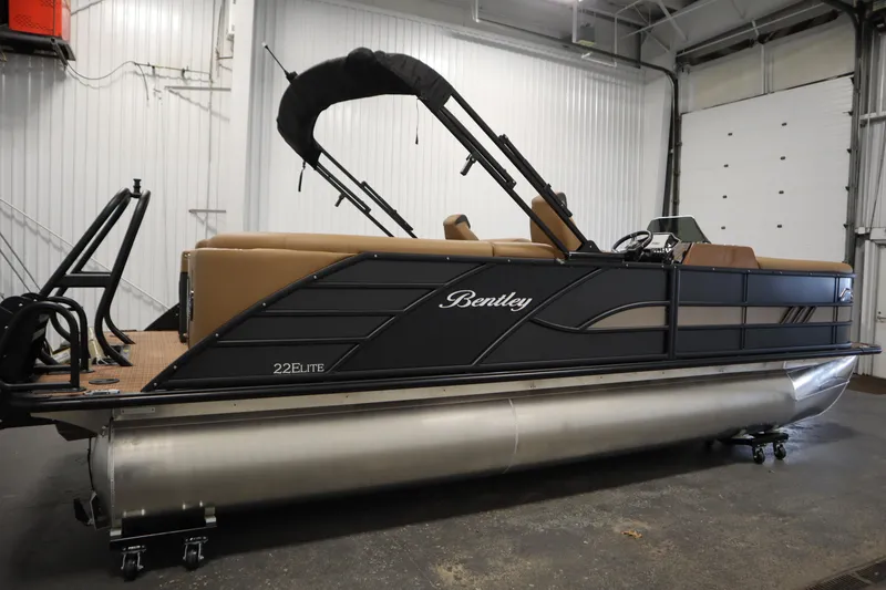 Slide: The Image of 2026 Bentley Pontoons Elite 223 Admiral Tri-toon in a showroom setting. - 3