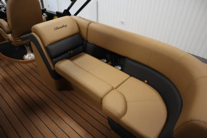 Slide: The Image of 2026 Bentley Pontoons Elite 223 Admiral Tri-toon interior with tan and black seating. - 34