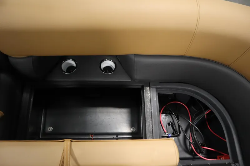 Slide: The Image of 2026 Bentley Pontoons Elite 223 Admiral Tri-toon interior storage with wiring and cup holders. - 36