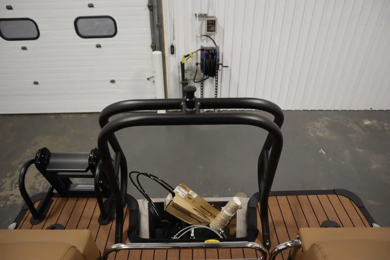 Slide: The Image of 2026 Bentley Pontoons Elite 223 Admiral Tri-toon interior with wooden deck and equipment. - 38